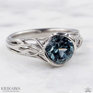 Tree branch engagement ring with round cut montana sapphire