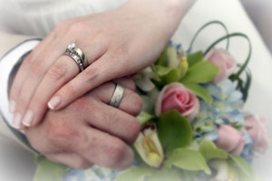 engagement ring and wedding ring photo with flowers