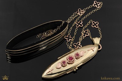 Reliquary Locket and Stand in 14k yellow gold and 14k rose gold with ruby accent stones