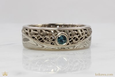 Carbon Mokume Wedding Band in White Mokume with 14k pd white gold liner and natural sapphire