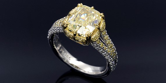 Natural fancy colored yellow diamond in engagement ring
