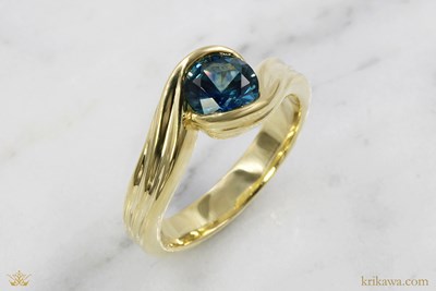 Curved Wave Bezel Engagement Ring in 18k yellow gold with sapphire