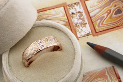 Mokume Floating Diamond Wedding Band with autumn mokume, 14k rose gold liner and natural princess-cut diamonds