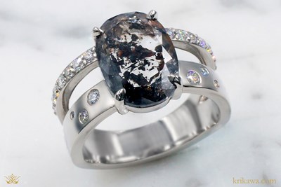 Negative Space Engagement Ring in platinum with oval salt and pepper diamond