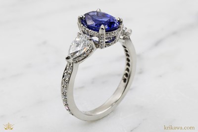 Three Stone Hidden Halo Engagement Ring in platinum with lab-grown sapphire