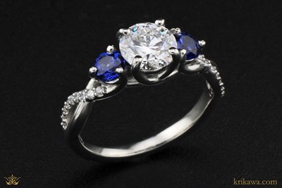 Three Stone Twist Engagement Ring in platinum with lab-grown diamonds and lab-grown sapphire