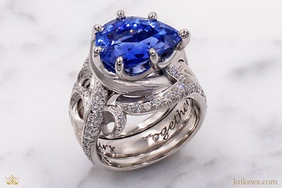 Ocean Wave Scaffold Engagement Ring in platinum with pear blue sapphire